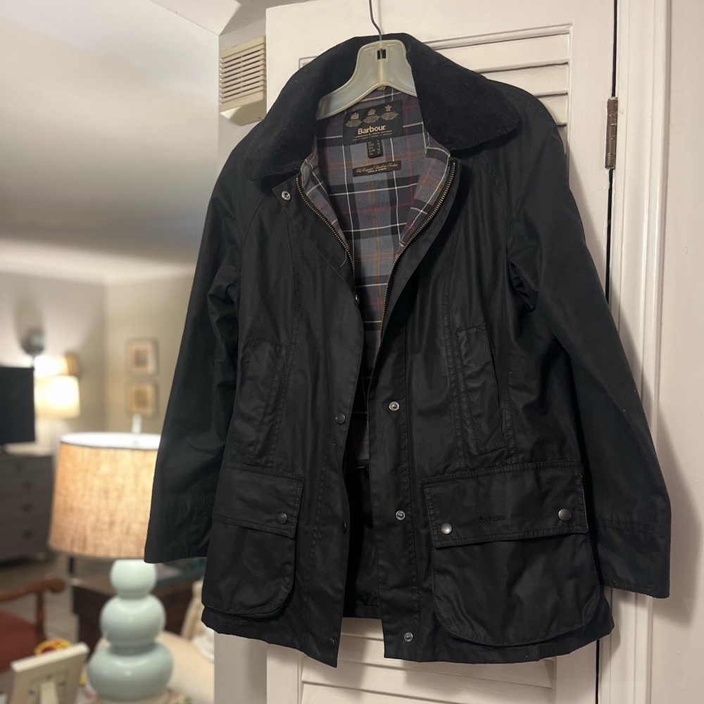 Women’s Barbour wax coat with lined black vest.